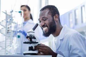 Man using microscope