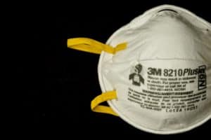 N95 mask on black background