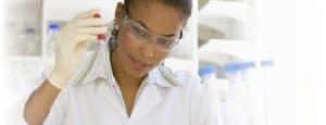 Researcher titrating a liquid